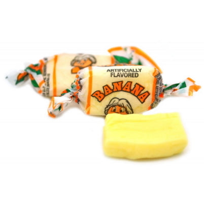 Close up of wrapped and unwrapped Albert's banana flavored chew candy