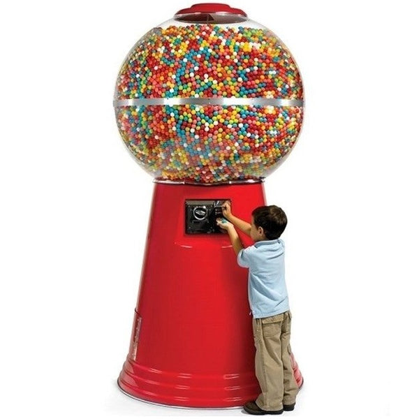 Kid buying a gumball from a red colored Jumbo Giant gumball machine
