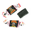 Close up of wrapped and unwrapped Albert's Black Cherry flavored chew candy