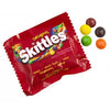 Close up of Original Skittles Fruit Flavored Fun Size  pack and 5 candy pieces
