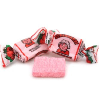 Close up of wrapped and unwrapped Albert's Strawberry flavored chew candy
